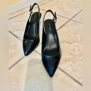 Black patent leather pumps